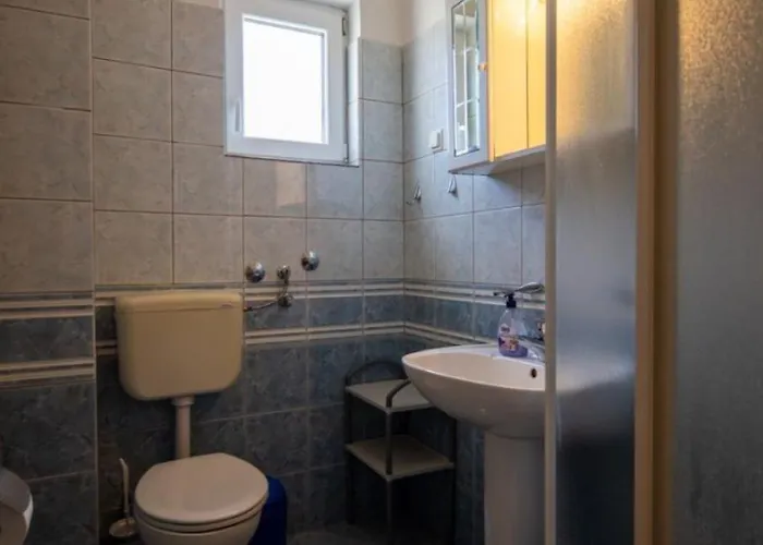 Den *