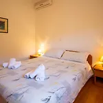 Den *